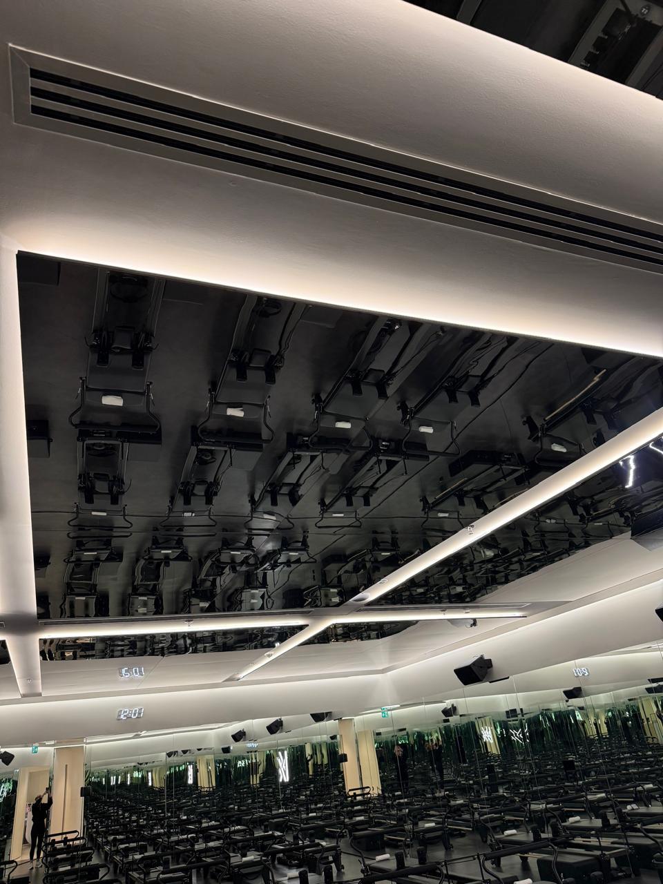 Premium cycling/spin studio interior with mirror ceiling