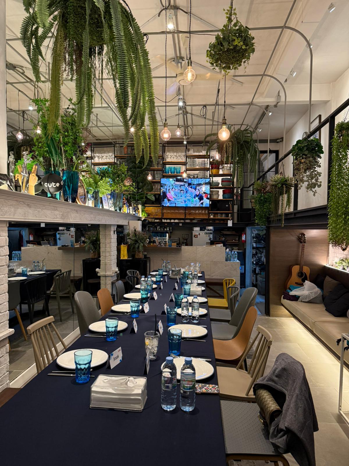 F&B restaurant interior with industrial ceiling and plants